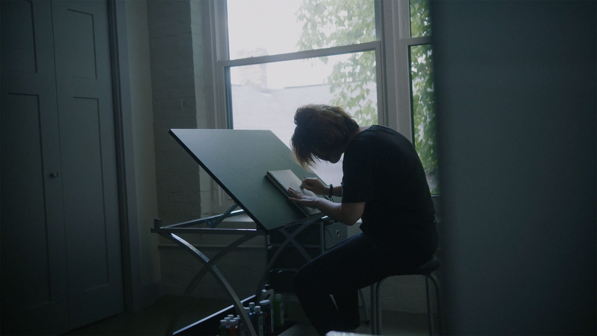 Artist Drawing On Easel