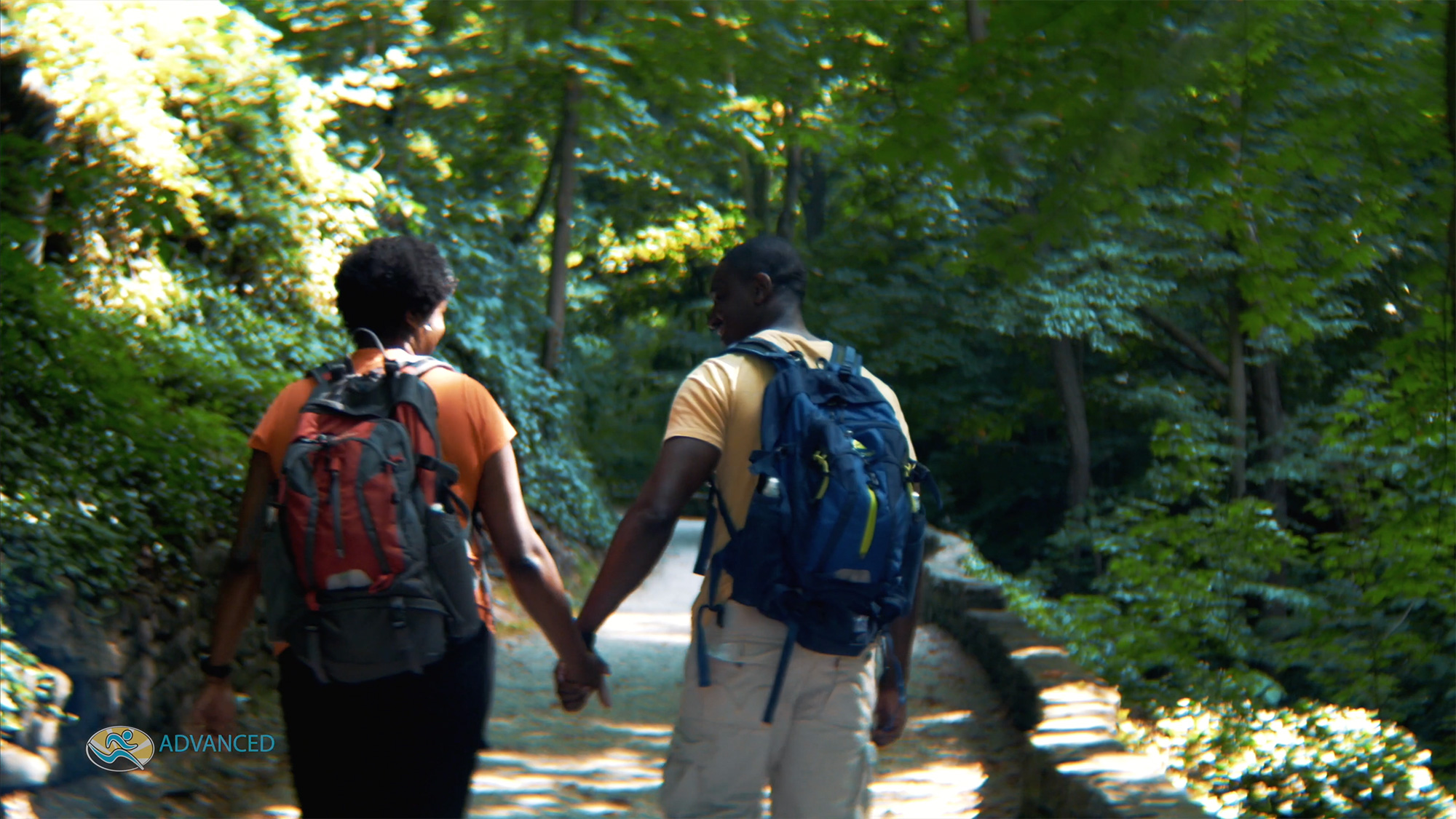 Couple holding hands walking in nature
