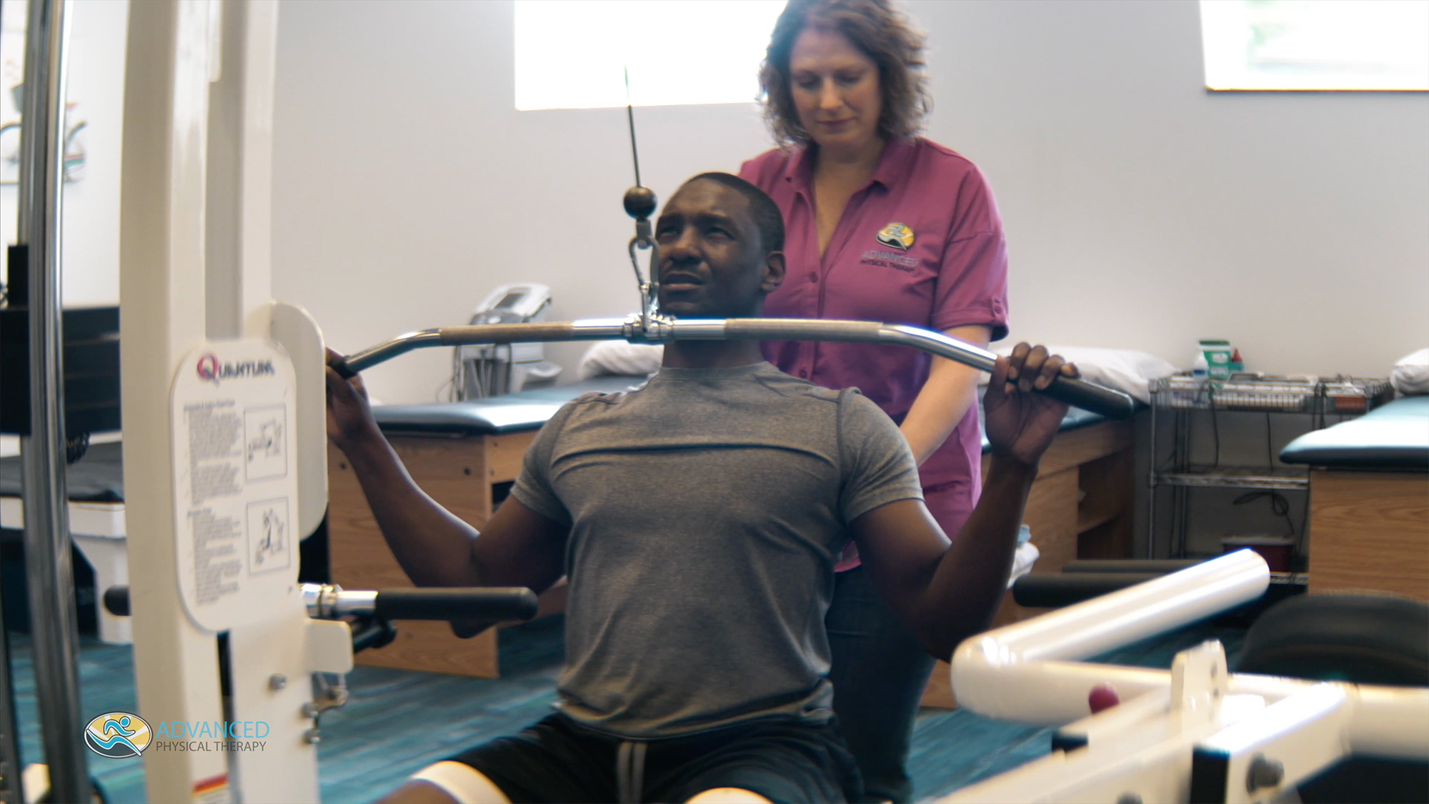 Man performing physical therapy with nurse