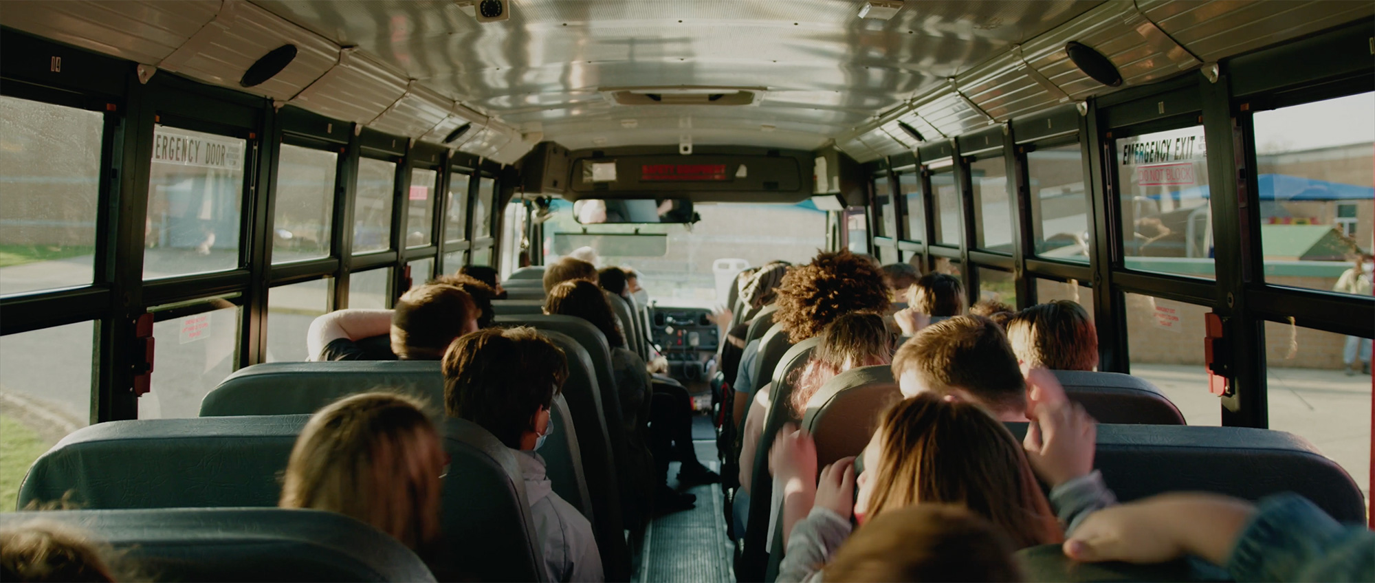 Children riding on a school bus